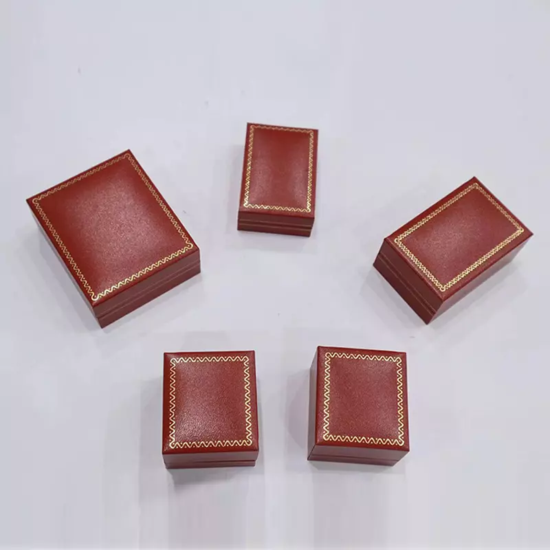 Right-angled straight-edge box with red curves and gold patterns