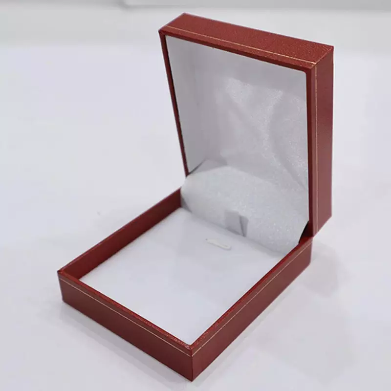 Right-angled straight-edge box with red curves and gold patterns